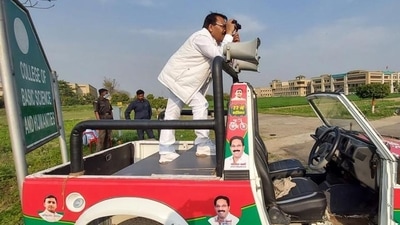 SP candidate from Hastinapur Yogesh Verma keeping a watch on the strong room through binoculars.&nbsp; (Hastinapur)