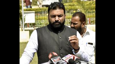 Bihar Panchayati raj minister Samrat Choudhary interacts with the media outside the assembly on Friday. (Santosh Kumar/HT Photo)