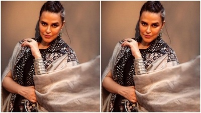 Neha played muse to fashion designer Samant Chauhan and picked a black and silver co-ord set to play host for the awards ceremony. (Instagram/@nehadhupia)