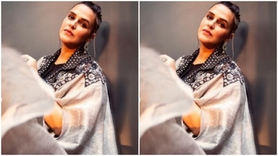 "Host mode on," wrote Neha as she posed while looking directly at the camera. (Instagram/@nehadhupia)
