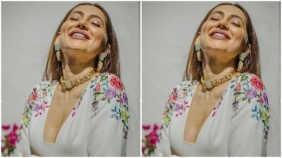 Anusha paired a satin full-sleeved blouse with a long flowy white skirt as she posed for the outdoor photoshoot. (Instagram/@vjanusha)