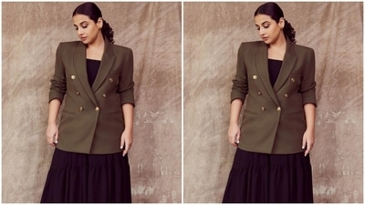 Vidya chose a black midi dress featuring a square neckline, tiered skirt, asymmetrical hemline, and a flowy silhouette. It is from the shelves of a clothing brand called Poppi. She provided structure to her ensemble by layering it with a blazer from the fast-fashion label Zara. (Instagram/@who_wore_what_when) Vidya chose a black midi dress featuring a square neckline, tiered skirt, asymmetrical hemline, and a flowy silhouette. It is from the shelves of a clothing brand called Poppi. She provided structure to her ensemble by layering it with a blazer from the fast-fashion label Zara. (Instagram/@who_wore_what_when)