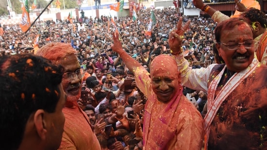 Chief minister Yogi Adityanath along with deputy CM Keshav Prasad Maurya, BJP state president Swatantra Dev Singh and others celebrating at BJP state headquarter in Lucknow. (Deepak Gupta/HT Photo)