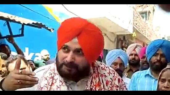 Punjab Congress president Navjot Singh Sidhu interacting with supporters in Amritsar East constituency on Friday, a day after he lost the election to AAP’s Jeevan Jyot Kaur. (ANI Photo)