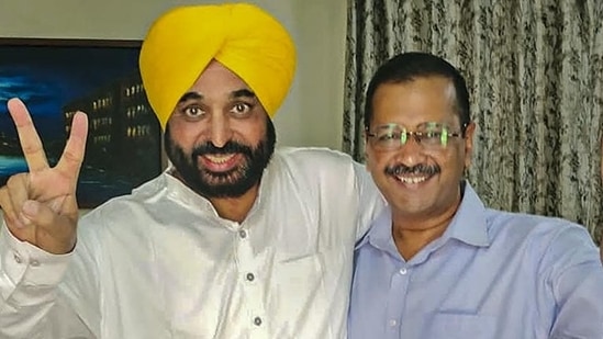 Punjab CM-elect Bhagwant Mann with AAP national convenor Arvind Kejriwal after the party's win in Punjab. (Twitter)(HT_PRINT)