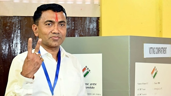 Goa Chief Minister Pramod Sawant shows victory sign after casting his vote for Goa Assembly elections, at Sanquelim/ (Atish Naik)