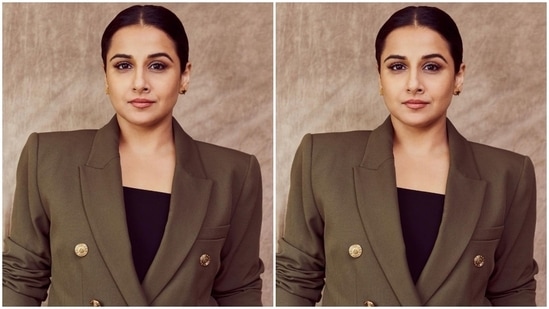 The double-breasted blazer comes in an olive green shade and features long pulled-back sleeves, raised shoulders, notch-lapel collars, metallic gold buttons on the front, patch pockets, and an oversized fitting.(Instagram/@who_wore_what_when)