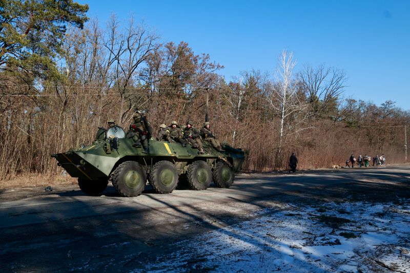 Members of the Ukrainian forces sit on a military vehicle amid Russia's invasion of Ukraine, in the Vyshgorod region near Kyiv, Ukraine March 10, 2022. (REUTERS)