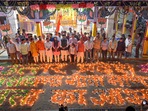 BJP workers light lamps to celebrate the party's victory in the Uttar Pradesh, Uttarakhand, Goa and Manipur assembly elections, in Bhopal on Friday. (PTI) BJP workers light lamps to celebrate the party's victory in the Uttar Pradesh, Uttarakhand, Goa and Manipur assembly elections, in Bhopal on Friday. (PTI)