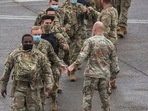 US soldiers walk to a chartered plane during their deployment to Europe. The unit will join the 3,800 troops, already deployed in support of NATO in Eastern Europe. US soldiers walk to a chartered plane during their deployment to Europe. The unit will join the 3,800 troops, already deployed in support of NATO in Eastern Europe.