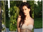 Disha Patani aces the triple kick. Tiger Shroff reacts