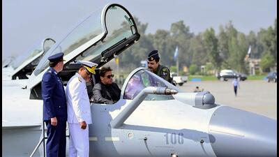 A Pakistan Air Force official briefs Prime Minister Imran Khan, center in cockpit, about Chinese-built J-10C fighter jet during a ceremony in Minhas Base near Islamabad, Pakistan on Friday. (AP) A Pakistan Air Force official briefs Prime Minister Imran Khan, center in cockpit, about Chinese-built J-10C fighter jet during a ceremony in Minhas Base near Islamabad, Pakistan on Friday. (AP)