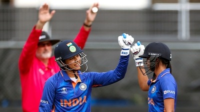 Harmanpreet Kaur and Smriti Mandhana fist bump each other during the ICC Women's World Cup 2022 match between India Women and West Indies Women, at Seddon Park, in Hamilton (ANI)