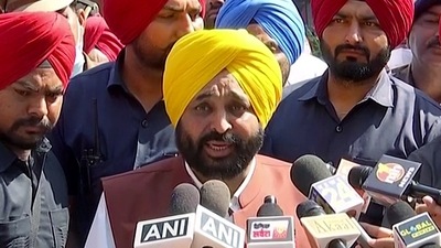 Punjab chief minister-designate Bhagwant Mann speaks to the media after meeting State Governor Banwarilal Purohit to stake claim to form the new government in Punjab. (ANI)
