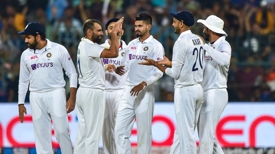 India's Mohd. Shami celebrates the wicket of Sri Lanka's Dimuth Karunaratne during the first day of 2nd test cricket match between India and Sri Lanka at Chinnaswamy Stadium, in Bengaluru, Saturday, March 12, 2022 (PTI) India's Mohd. Shami celebrates the wicket of Sri Lanka's Dimuth Karunaratne during the first day of 2nd test cricket match between India and Sri Lanka at Chinnaswamy Stadium, in Bengaluru, Saturday, March 12, 2022 (PTI)