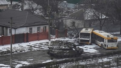 A Russian army tank moves through a street on the outskirts of Mariupol, Ukraine. (AP) A Russian army tank moves through a street on the outskirts of Mariupol, Ukraine. (AP)