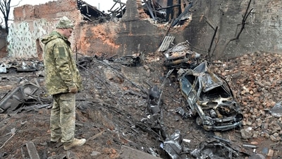 A Ukrainian serviceman looks at destructions following a shelling in Ukraine's second-biggest city of Kharkiv. (AFP) A Ukrainian serviceman looks at destructions following a shelling in Ukraine's second-biggest city of Kharkiv. (AFP)