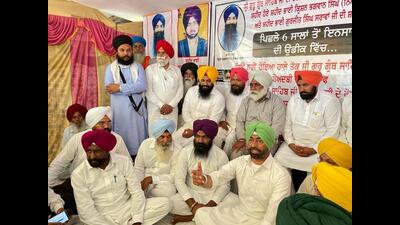 Bholath MLA Sukhpal Khaira with 2015 police firing victim’s son Sukhraj Singh at Behbal Kalan village in Faridkot on Saturday. (HT Photo) Bholath MLA Sukhpal Khaira with 2015 police firing victim’s son Sukhraj Singh at Behbal Kalan village in Faridkot on Saturday. (HT Photo)
