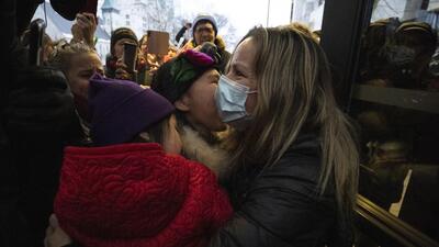 Tamara Lich (centre), who organized fundraising for the Freedom Convoy trucker protest which became a weeks-long blockade, greets supporters as she leaves the courthouse in Ottawa after being granted bail, on March 7. (AP)