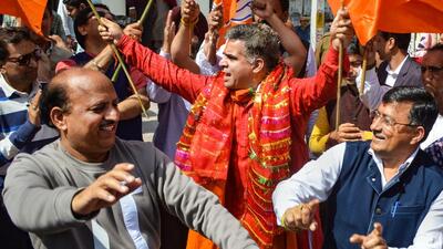 J&K BJP chief Ravinder Raina celebrating with workers the party's performance in the recent assembly elections. (PTI file photo)