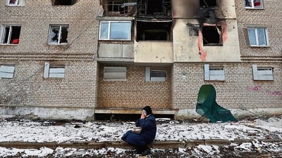 A woman reacts in front of a damaged building in the Donetsk region in Ukraine. (Reuters) A woman reacts in front of a damaged building in the Donetsk region in Ukraine. (Reuters)