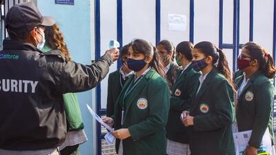 Student undergo thermal screening before entering an examination centre to appear for the CBSE's Term 1 Class 12 board exams on December 21, 2021. (PTI) Student undergo thermal screening before entering an examination centre to appear for the CBSE's Term 1 Class 12 board exams on December 21, 2021. (PTI)