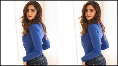 Aamna's blue top came with full sleeves and a midriff-baring detail on one side. Aamna accessorised her look with statement gold earrings. (Instagram/@aamnasharifofficial)