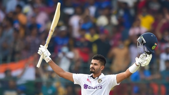 India's batter Shreyas Iyer raises his bat, in celebration after scoring fifty runs during the first day of 2nd test cricket match between India and Sri Lanka at Chinnaswamy Stadium, in Bengaluru, Saturday, March 12(PTI)