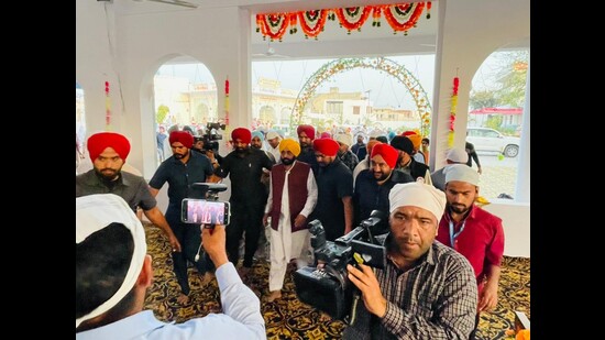 Punjab CM-designate Bhagwant Mann surrounded by the media as he reaches gurdwara Janam Asthan Cheema Sahib on Saturday to pay obeisance after AAP’s historic win in the state. (HT Photo) Punjab CM-designate Bhagwant Mann surrounded by the media as he reaches gurdwara Janam Asthan Cheema Sahib on Saturday to pay obeisance after AAP’s historic win in the state. (HT Photo)