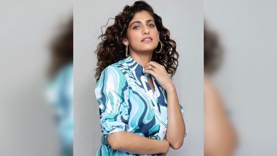 Kubbra Sait's outfit features a cut-out neck detail along with an attached tie-up scarf.(Instagram/@kubbrasait)