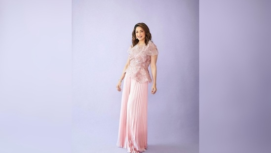 Madhuri Dixit's stylists added some soft beach waves to her hair and kept her makeup look neutral(Instagram/@madhuridixitnene)