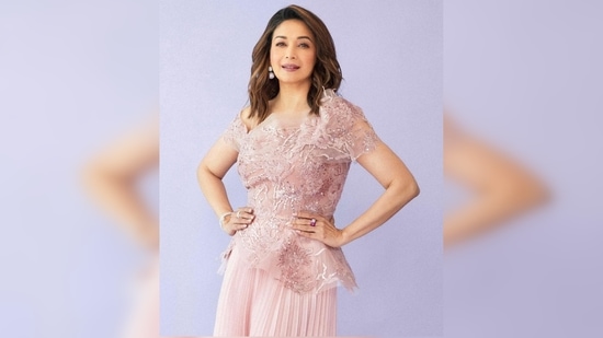 Madhuri Dixit's outfit is comprised of mesh top and flared pleated pants.(Instagram/@madhuridixitnene)