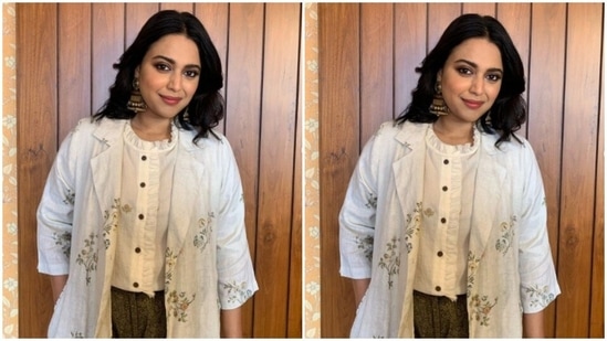 Swara added more sass to her look with a white long full-sleeved shrug with floral patterns.(Instagram/@reallyswara)