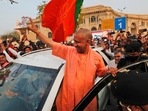 Yogi Adityanath waves to supporters as he arrives at the Bharatiya Janata Party headquarters after his party won the state assembly election, in Lucknow.(HT_PRINT) Yogi Adityanath waves to supporters as he arrives at the Bharatiya Janata Party headquarters after his party won the state assembly election, in Lucknow.(HT_PRINT)
