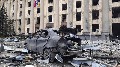 A burnt car is seen in front of a damaged City Hall building, in Kharkiv, Ukraine (AP) A burnt car is seen in front of a damaged City Hall building, in Kharkiv, Ukraine (AP)