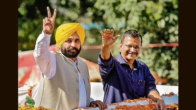 Delhi chief minister and AAP convener Arvind Kejriwal with Punjab CM-designate Bhagwant Mann, in Amritsar on Sunday. (PTI) Delhi chief minister and AAP convener Arvind Kejriwal with Punjab CM-designate Bhagwant Mann, in Amritsar on Sunday. (PTI)