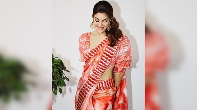 Jacqueline Fernandez teamed her saree with a backless blouse with puffed elbow-length sleeves. (Instagram/@jacquelinef143) Jacqueline Fernandez teamed her saree with a backless blouse with puffed elbow-length sleeves. (Instagram/@jacquelinef143)