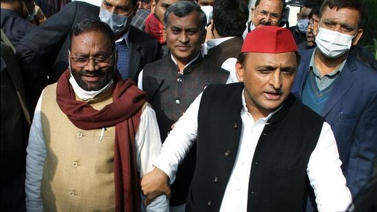 Samajwadi Party chief Akhilesh Yadav with former minister Swami Prasad Maurya. (ANI FILE PHOTO)