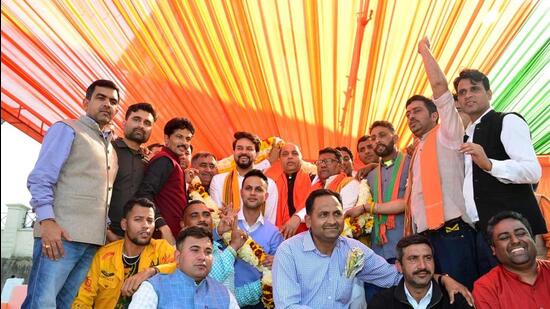 Chief minister Jai Ram Thakur with Union minister Anurag Thakur during a public meeting at Bilaspur district, Hamirpur, on Sunday. So far, 22 defence factories have been set up across the country. A bulletproof vest manufacturing factory will also be set up in Himachal, he said. (HT Photo)