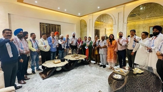 Amritsar civic body officials with Manish Sisodia in a photo tweeted by @AamAadmiParty(Twitter)