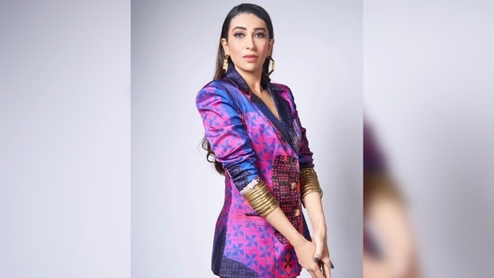 Karisma Kapoor, who is not afraid of experimenting with her looks, opted for a quirky yet trendy pantsuit for her photoshoot.(Instagram/@therealkarismakapoor)