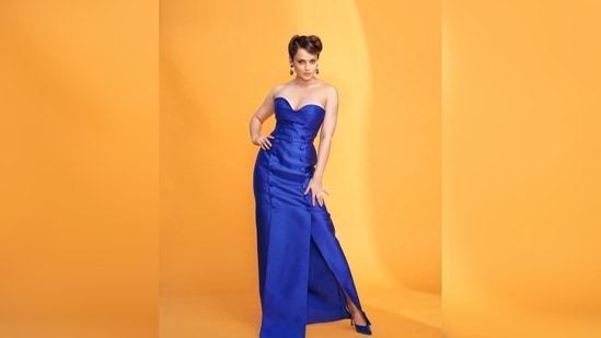 Kangana Ranaut's dress features a long slit that went up till her thighs, a belt around the waist and two lines of buttons.(Instagram/@ziadgermanosworld)