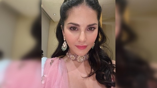 Sunny Leone parted her hair in the middle and half braided it and left the other half wavy.(Instagram/@sunnyleone)