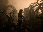 A Ukrainian firefighter drags a hose inside a large food products storage facility which was destroyed by an airstrike in the early morning hours on the outskirts of Kyiv, (AP Photo/Vadim Ghirda)(AP) A Ukrainian firefighter drags a hose inside a large food products storage facility which was destroyed by an airstrike in the early morning hours on the outskirts of Kyiv, (AP Photo/Vadim Ghirda)(AP)