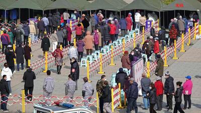 Residents queue to undergo nucleic acid tests for Covid-19 in Yantai, in China’s eastern Shandong province on Monday. (AFP) Residents queue to undergo nucleic acid tests for Covid-19 in Yantai, in China’s eastern Shandong province on Monday. (AFP)