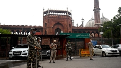Security forces stand guard outside the Jama Masjid on the early hours. (Money SHARMA/AFP)