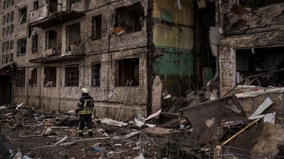 A Ukrainian firefighter stands outside a destroyed building after it was hit by artillery shelling in Kyiv, Ukraine. (AP) A Ukrainian firefighter stands outside a destroyed building after it was hit by artillery shelling in Kyiv, Ukraine. (AP)