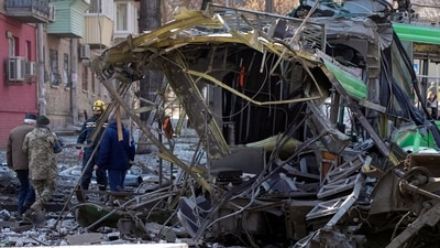 Police inspect a destroyed trolley bus on the site of a Russian bombing attack in Kyiv, Ukraine. (AP) Police inspect a destroyed trolley bus on the site of a Russian bombing attack in Kyiv, Ukraine. (AP)