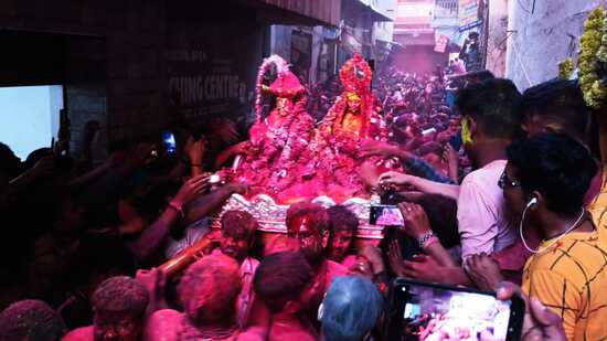 Devotees celebrating Rangbhari Ekadashi in Kashi on Monday. (HT photo)