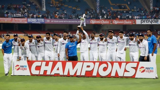 Indian players pose with the trophy after completing a clean sweep over Sri Lanka in the two-match Test series.(ANI)